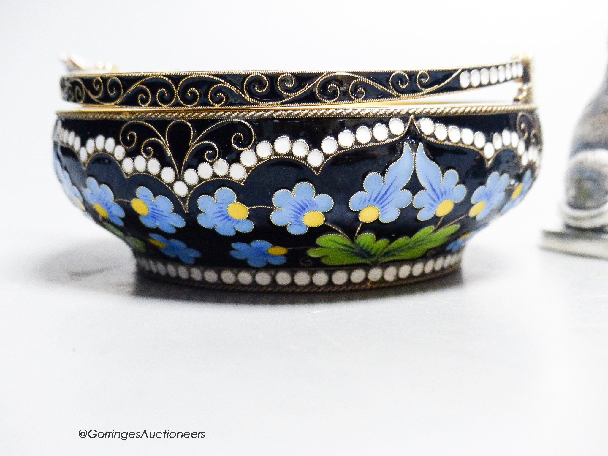 A group of Russian style metalware and a silver and enamel basket